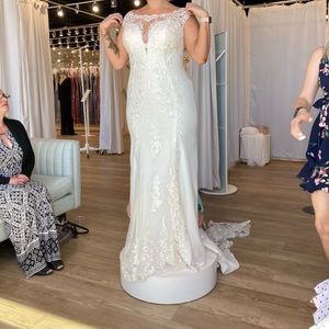 Brand new wedding dress never worn.
